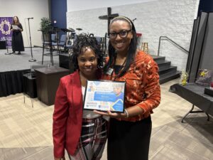 TA Consultant and Director receiving an award
